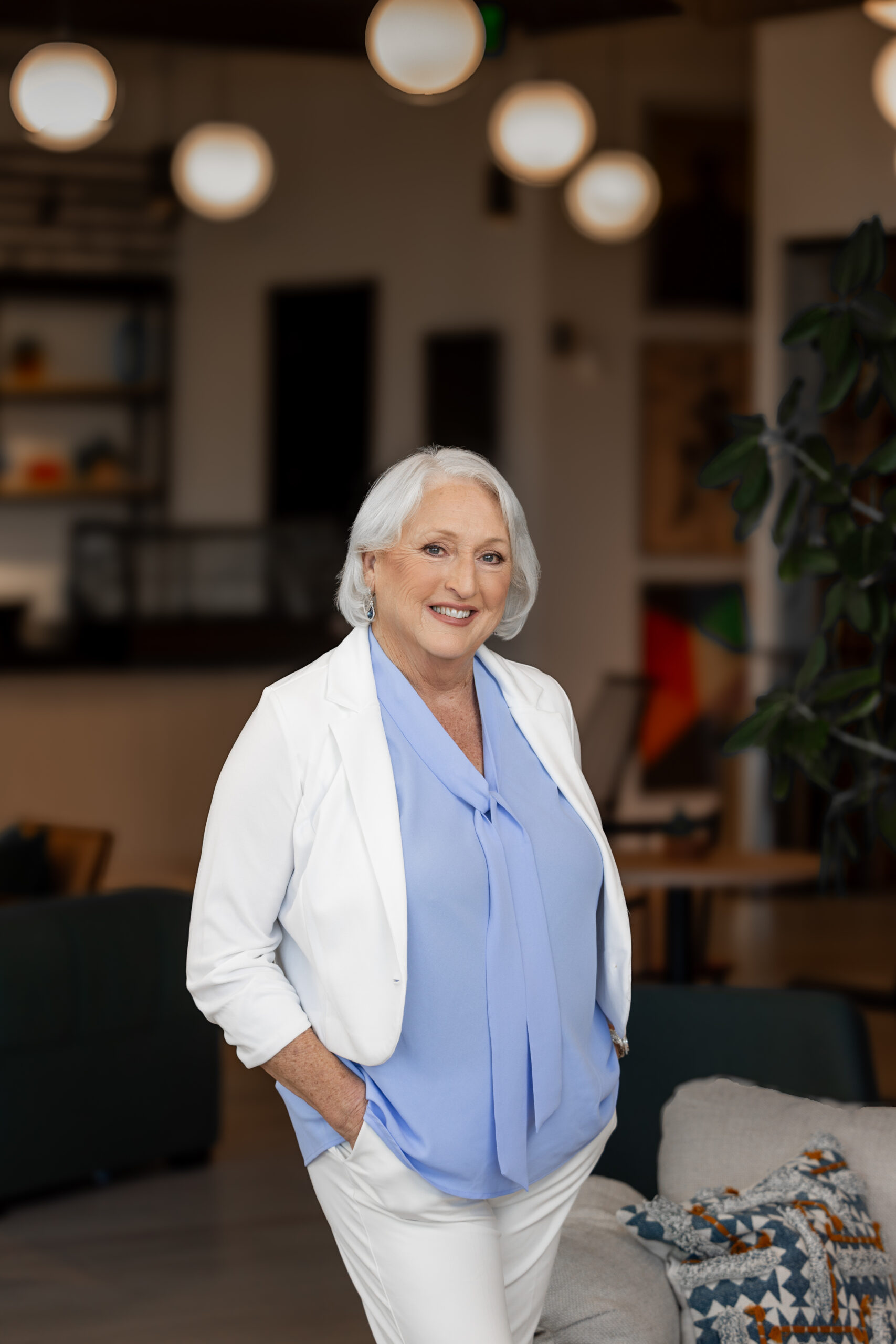 Debbie Widhalm standing in blazer