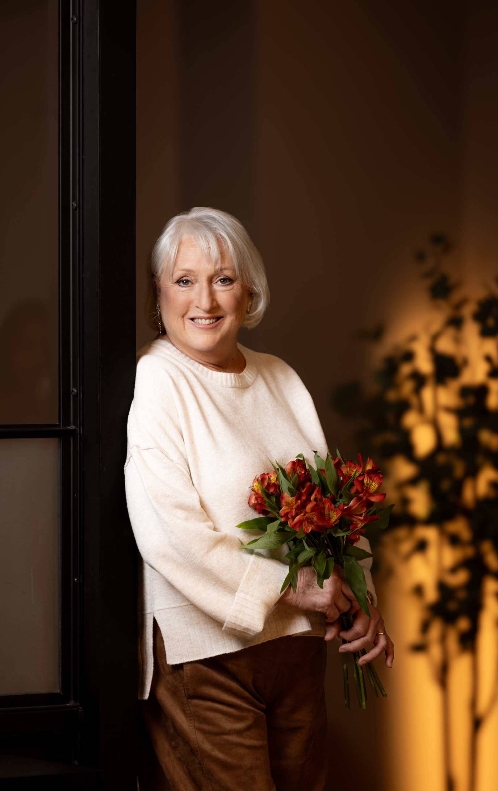 Debbie Widhalm standing confidently, symbolizing healing, leadership, and personal growth